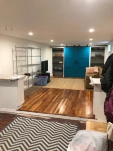 A room with hard wood floors and blue walls.